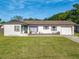 Charming single-story home with a well-manicured lawn and a quaint, inviting facade at 243 S Hull Ave, Deland, FL 32720