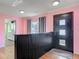 View of the home's entryway showing hardwood floors and access to kitchen and living room at 243 S Hull Ave, Deland, FL 32720