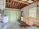 Unfinished garage space with washer/dryer and cabinetry at 243 S Hull Ave, Deland, FL 32720