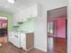 Cozy kitchen with white appliances and ample cabinet space at 243 S Hull Ave, Deland, FL 32720