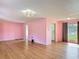 Bright living room featuring hardwood floors and sliding glass doors at 243 S Hull Ave, Deland, FL 32720