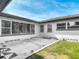 Outdoor patio featuring a modern design with an abundance of natural light and access to the backyard at 243 S Hull Ave, Deland, FL 32720
