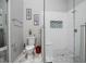 Modern bathroom features a walk-in shower with white tile and mosaic accents, plus a stylish marble floor at 2596 Lancaster Ct, Apopka, FL 32703