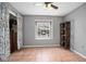 Bedroom features tile floors, a large window, ceiling fan and a built-in closet at 2596 Lancaster Ct, Apopka, FL 32703