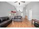 Bright open-concept living room featuring vaulted ceilings and hardwood floors at 2596 Lancaster Ct, Apopka, FL 32703