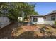 Exterior home view of backyard featuring grass and a storage shed at 265 S Fairbairn Dr, Deltona, FL 32725