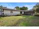 A spacious backyard offers a serene outdoor space with a well-maintained lawn at 265 S Fairbairn Dr, Deltona, FL 32725