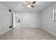 Bright bedroom with neutral walls and tile floors at 265 S Fairbairn Dr, Deltona, FL 32725