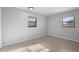 Simple bedroom with neutral walls and neutral tile flooring at 265 S Fairbairn Dr, Deltona, FL 32725