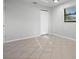 Neutral bedroom with tile floors and window at 265 S Fairbairn Dr, Deltona, FL 32725