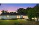 A cozy single-story home with a well-maintained lawn and mature trees in a quiet neighborhood at 265 S Fairbairn Dr, Deltona, FL 32725