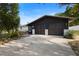 The home's garage features two bays and ample parking space in front at 265 S Fairbairn Dr, Deltona, FL 32725