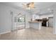 Functional kitchen with a breakfast bar and convenient access to the sunroom, perfect for relaxed living at 265 S Fairbairn Dr, Deltona, FL 32725