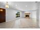 Bright living room with neutral walls, large window, and stone fireplace at 265 S Fairbairn Dr, Deltona, FL 32725