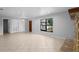 Spacious living area featuring tile floors, a decorative fireplace, and natural light, blending comfort and style at 265 S Fairbairn Dr, Deltona, FL 32725