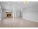 Spacious living room featuring a stone fireplace as a focal point for relaxing and entertaining at 265 S Fairbairn Dr, Deltona, FL 32725