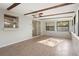 Bright sunroom with exposed beams, lots of light, and sliding glass doors at 265 S Fairbairn Dr, Deltona, FL 32725