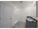 Bathroom featuring a double sink vanity with marble countertops, tile floors, and a shower with white tiling at 2686 Neverland Dr, New Smyrna Beach, FL 32168