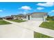 Well-maintained one-story house in a residential neighborhood with a two-car garage and manicured lawns at 2686 Neverland Dr, New Smyrna Beach, FL 32168
