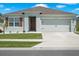 Charming single-story home with a well-manicured lawn, a two car garage, and a welcoming entrance at 2686 Neverland Dr, New Smyrna Beach, FL 32168