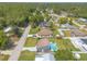 Aerial view of a home with a private pool and well-maintained landscaping in a peaceful residential neighborhood at 2819 Silver Palm Dr, Edgewater, FL 32141
