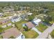 An aerial view of a neighborhood featuring well-maintained homes and lush, mature trees throughout the community at 2819 Silver Palm Dr, Edgewater, FL 32141