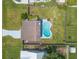 Bird's-eye view shows a home's pool, patio, and meticulously maintained yard, highlighting the outdoor living space at 2819 Silver Palm Dr, Edgewater, FL 32141