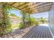 Lattice covered deck overgrown with vines in backyard at 2819 Silver Palm Dr, Edgewater, FL 32141