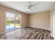 Bedroom with sliding glass door access to the fenced backyard and pool at 2819 Silver Palm Dr, Edgewater, FL 32141