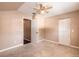 This carpeted bedroom features a ceiling fan, a window, and a closet at 2819 Silver Palm Dr, Edgewater, FL 32141