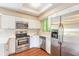 Updated kitchen with stainless steel appliances, modern cabinets, and sleek countertops at 2819 Silver Palm Dr, Edgewater, FL 32141