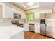 Modern kitchen featuring stainless steel appliances, white cabinetry, and a bright, airy atmosphere at 2819 Silver Palm Dr, Edgewater, FL 32141