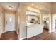 Bright and airy kitchen featuring stainless steel appliances, white cabinetry, and a breakfast bar at 2819 Silver Palm Dr, Edgewater, FL 32141