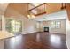 Bright living room featuring wood floors, a fireplace, and sliding glass doors to the outdoor space at 2819 Silver Palm Dr, Edgewater, FL 32141