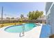 Backyard pool featuring a spa and a spacious concrete surround, perfect for outdoor relaxation at 2819 Silver Palm Dr, Edgewater, FL 32141