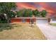 Charming brick home with a manicured lawn and mature trees in a quiet neighborhood at 291 Sagewood Dr, Port Orange, FL 32127