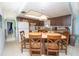Bright kitchen with an island table, pendant lighting, and traditional appliances at 291 Sagewood Dr, Port Orange, FL 32127