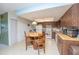 Functional kitchen featuring tile floors, an island table, and classic cabinetry at 291 Sagewood Dr, Port Orange, FL 32127