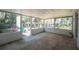 Enclosed patio, surrounded by lush greenery, provides a serene and private outdoor space at 291 Sagewood Dr, Port Orange, FL 32127