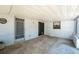 Covered patio with concrete flooring, offering space for outdoor seating and relaxation at 291 Sagewood Dr, Port Orange, FL 32127