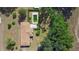 Aerial view of a house with a brown roof, yard, and rectangular in-ground pool at 2919 Griffin Rd, Leesburg, FL 34748