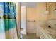 Modest bathroom with a tropical shower curtain and vanity sink at 2919 Griffin Rd, Leesburg, FL 34748