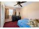 Bedroom with closet, vintage dresser, and a ceiling fan at 2919 Griffin Rd, Leesburg, FL 34748