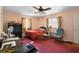 Bedroom featuring carpet flooring, natural light, and dresser storage at 2919 Griffin Rd, Leesburg, FL 34748
