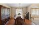 Traditional dining room featuring hardwood floors, a chandelier, and antique furnishings at 2919 Griffin Rd, Leesburg, FL 34748