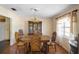 Dining room with wood floors, a chandelier, a hutch, and a wood table with seating for six at 2919 Griffin Rd, Leesburg, FL 34748