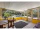 Enclosed sunroom with tile flooring and a view of the pool at 2919 Griffin Rd, Leesburg, FL 34748