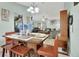 Bright dining area showcases a modern table set, complemented by natural lighting and an open-concept layout at 2937 Garret St, Deltona, FL 32738