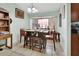 Cozy dining area featuring a unique dining table set, complemented by warm lighting and tiled flooring at 2937 Garret St, Deltona, FL 32738