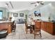 Open-concept kitchen and dining area featuring tile flooring, a breakfast bar, and comfortable seating at 2937 Garret St, Deltona, FL 32738